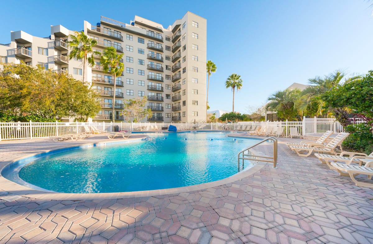 Outdoor pool in front of The Enclave tower