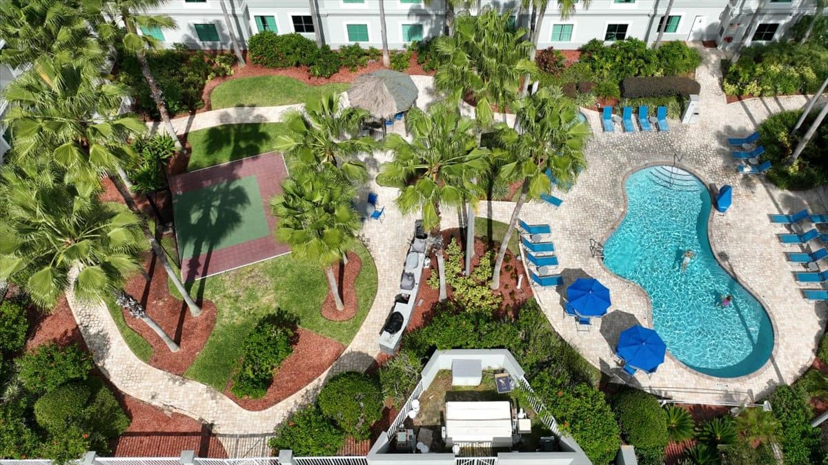 Pool and gardens at Hawthorn Suites seen from above